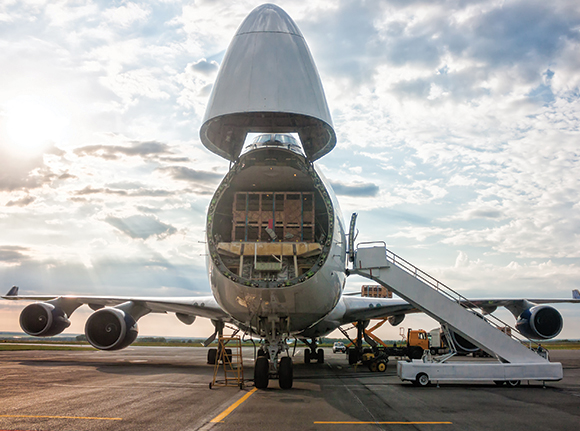 the front of a plane open with the freight cargo in view